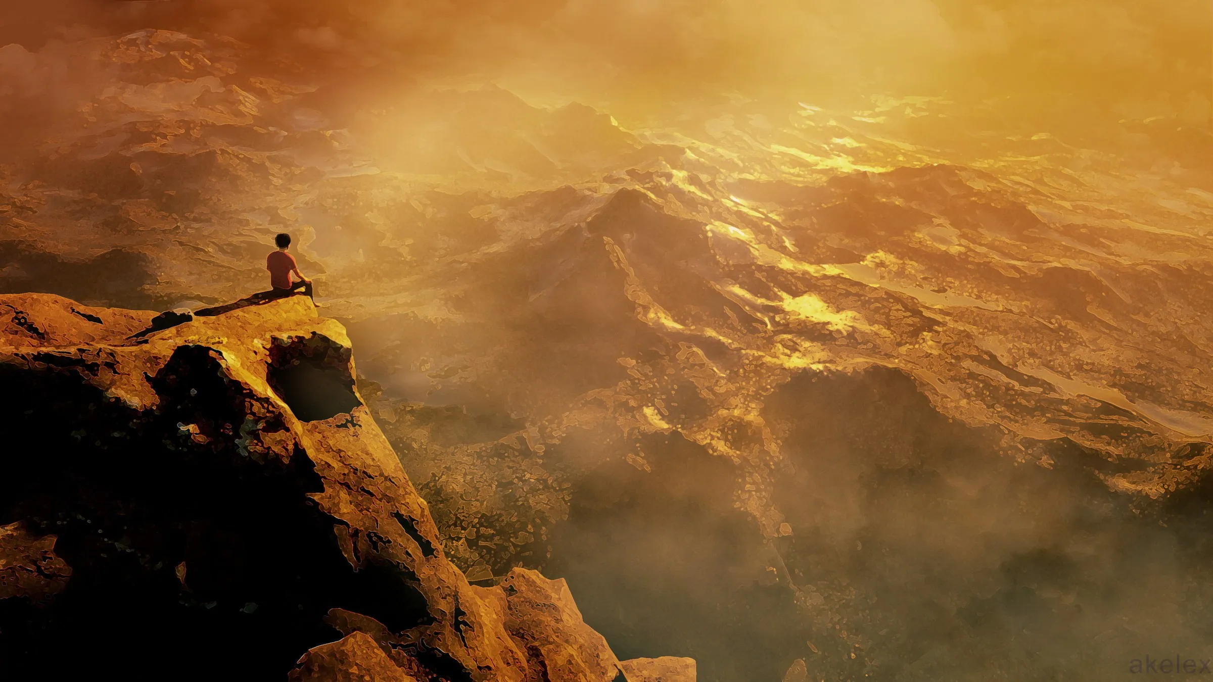 A person sits on the edge of a tall orange rock outcrop overlooking a vast rugged mountain range filled with warm golden mist and glinting sunlight.