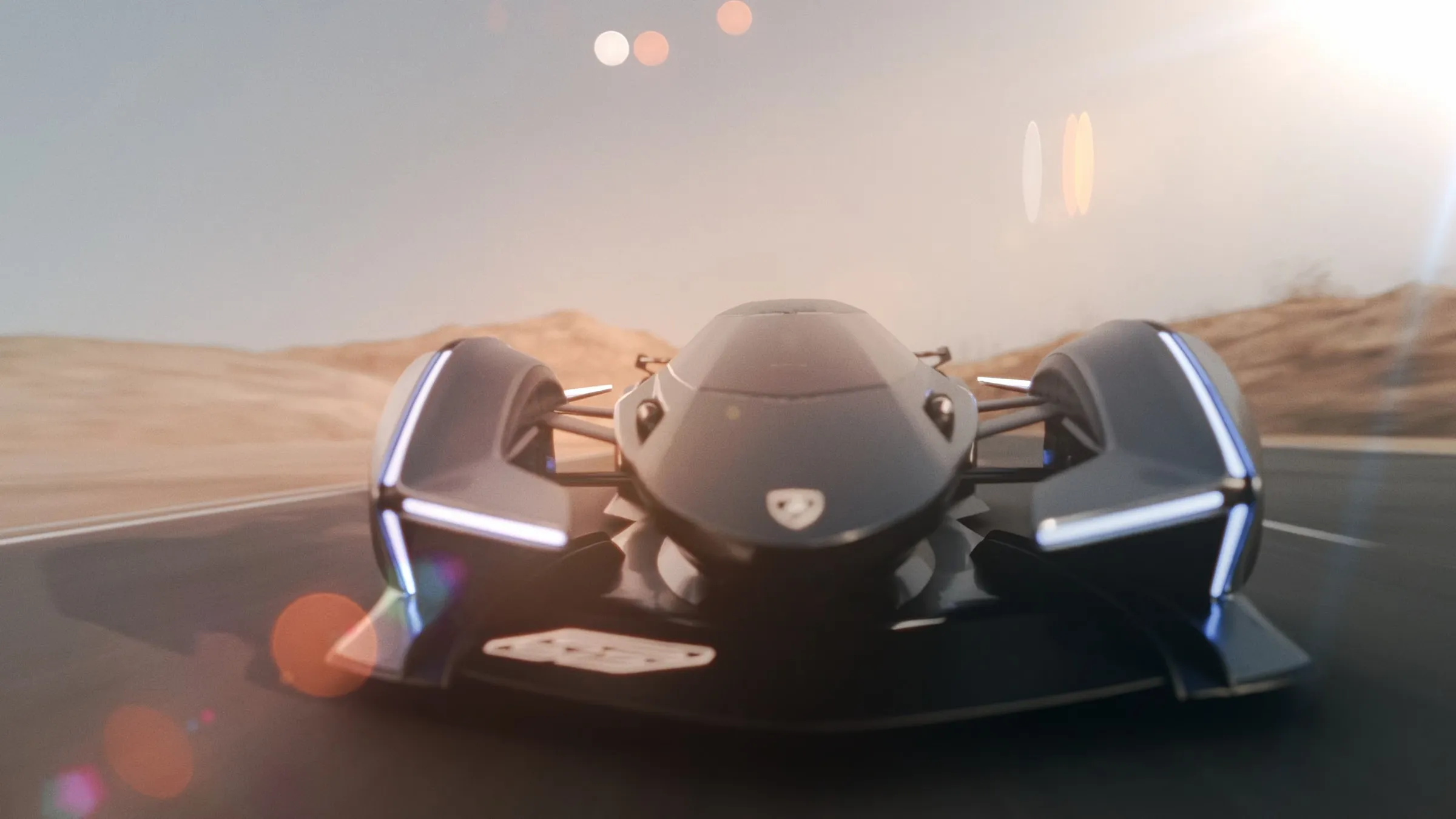Head-on view of a dark graphite Lamborghini V12 Vision GT concept hypercar on a desert road, thin white light strips glowing along its body.